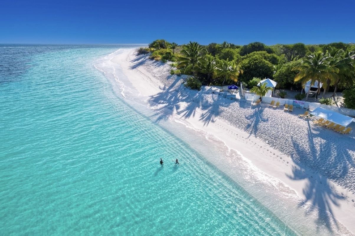 This English-Speaking Caribbean Island With 33 White Sand Beaches, 82°F Winters, And $8 Beach BBQ Is Breaking Tourism Records
